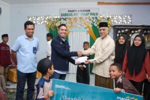 Bank Mandiri Santuni 100 Anak Yatim dan Bagikan 500 Paket Sembako di Kota Palu